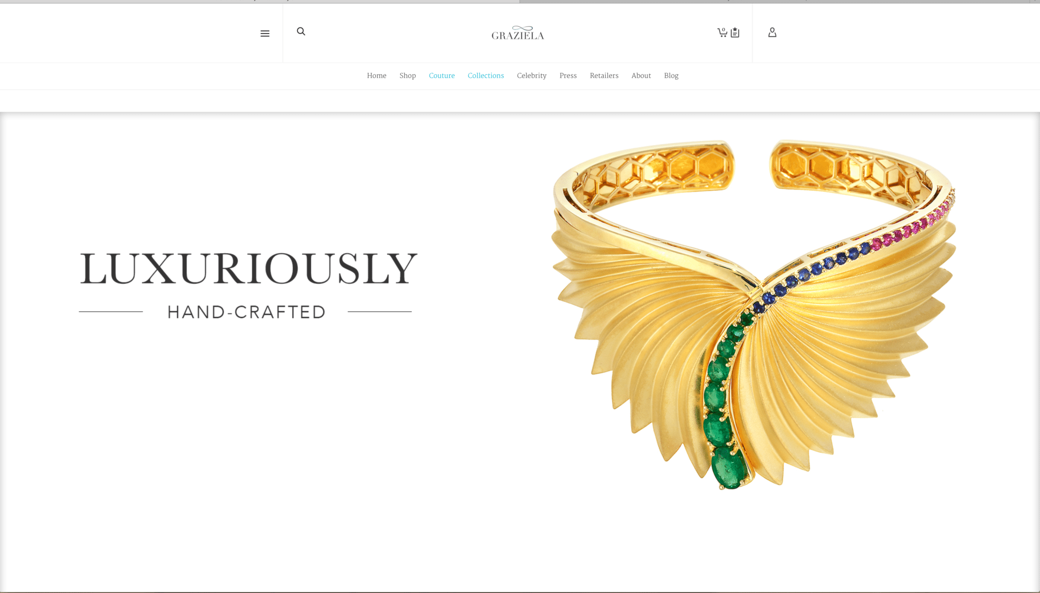 Ad Page for Graziela Jewelers featuring product shot of a large gold bracelet with a fan design and emeralds, sapphires and rubies running down the center all sitting on white with copy reading" Luxuriously Hand Crafted"