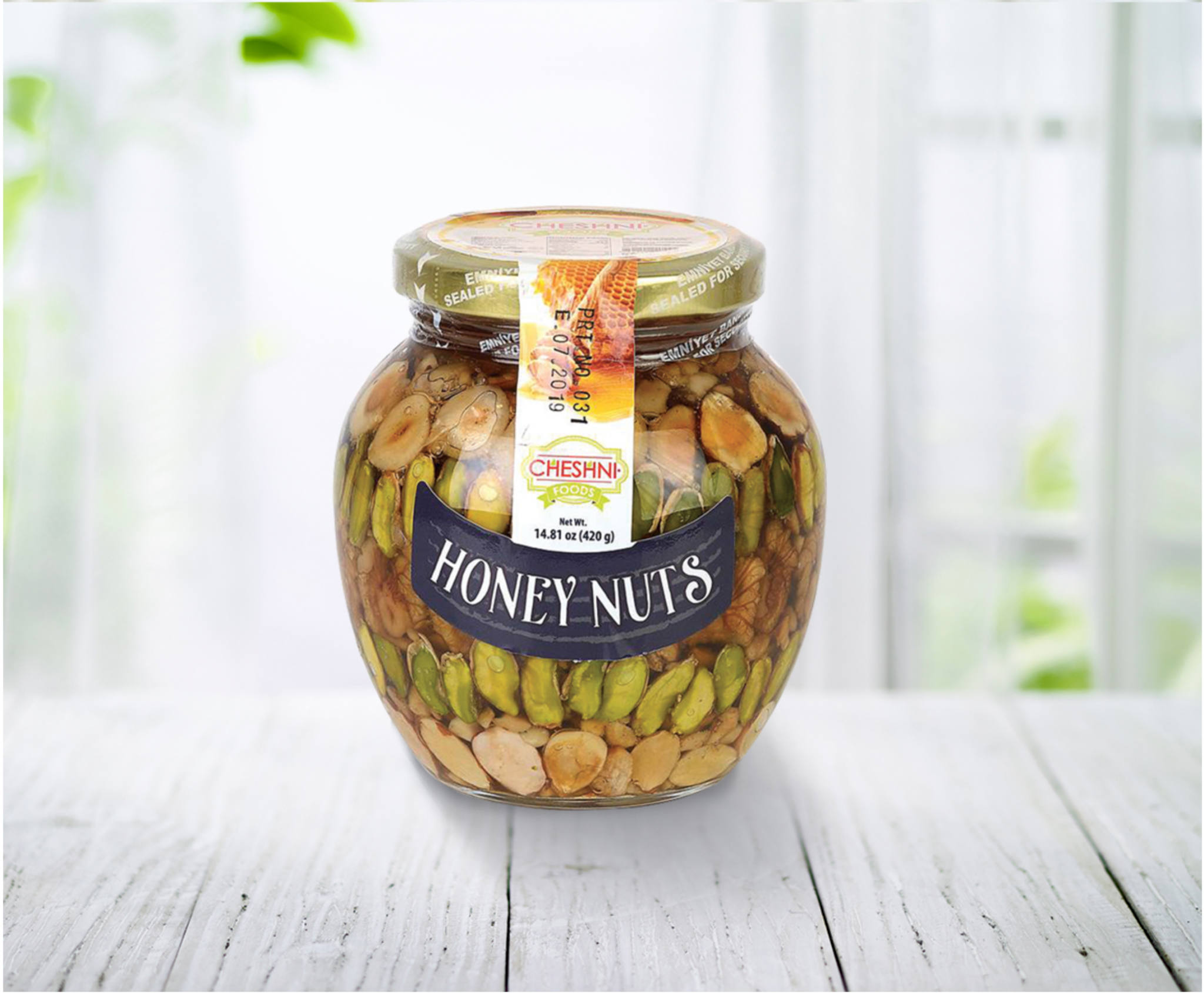 glass container of Honey Nuts in a setting on white boards and white windows