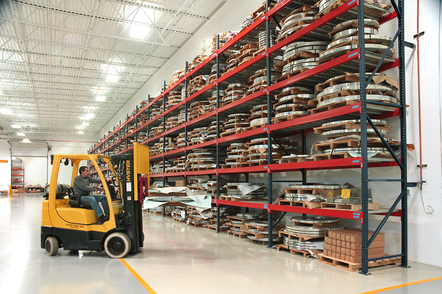 Warehouse showing racks and fork lift